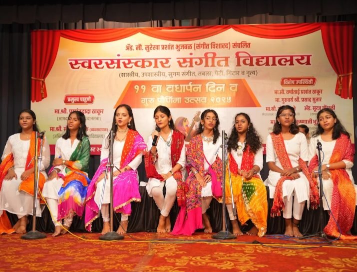 Students performing at the 11th Vardhapan Din anniversary celebration